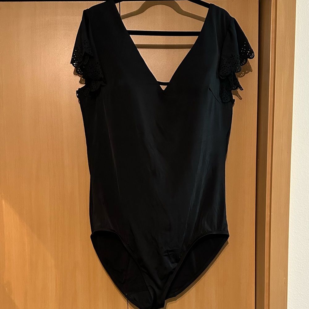 Lame Bryant bathing suit with laser cut arms